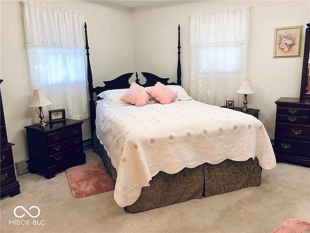 carpeted bedroom with a baseboard heating unit