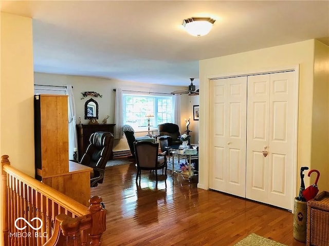 interior space featuring hardwood / wood-style flooring, ceiling fan, and a baseboard radiator