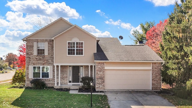 view of front property with a garage and a front lawn