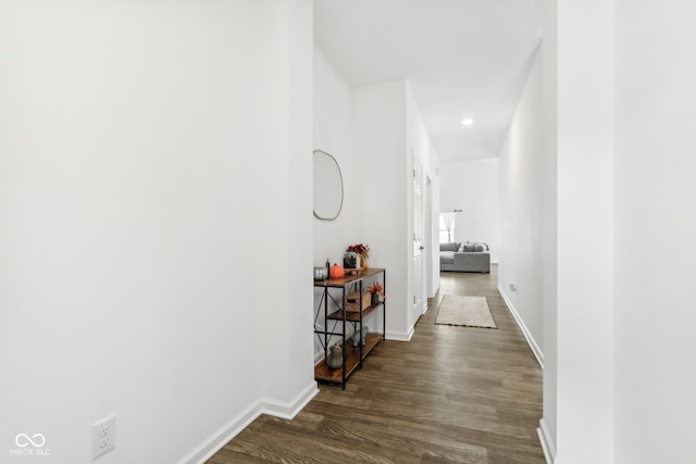 hallway featuring dark wood-type flooring