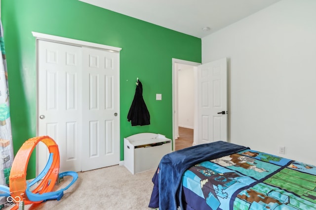 carpeted bedroom with a closet