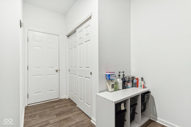 hall with dark hardwood / wood-style floors