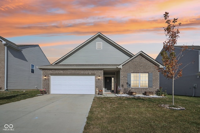 view of front facade featuring a garage and a lawn