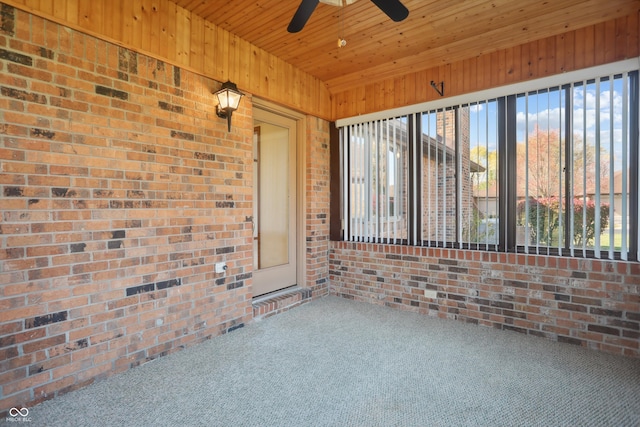 unfurnished sunroom featuring wood ceiling