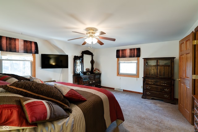 carpeted bedroom with ceiling fan