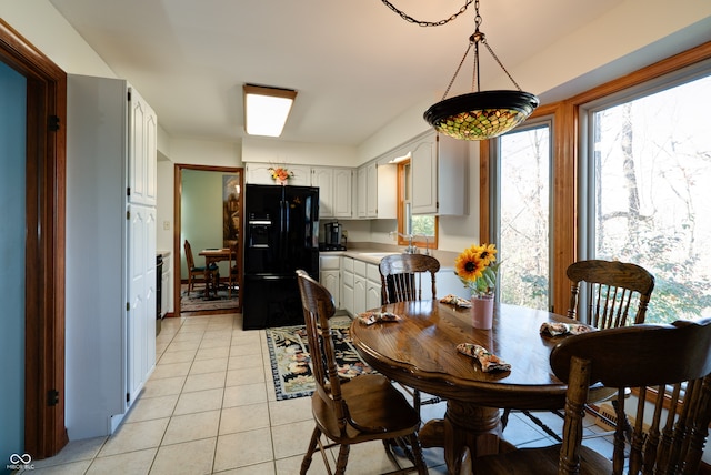 dining area featuring light tile patterned floors