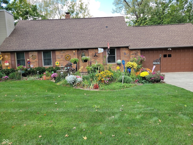 single story home featuring a garage and a front yard