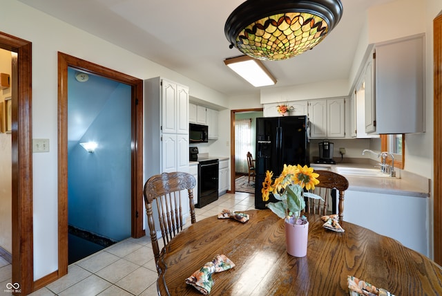 tiled dining room with sink