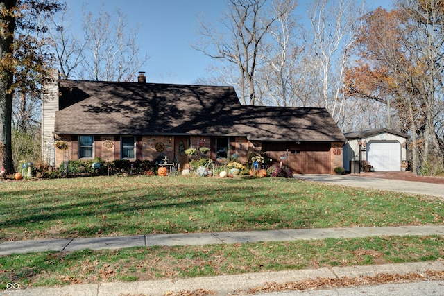 view of front of property featuring a garage and a front yard