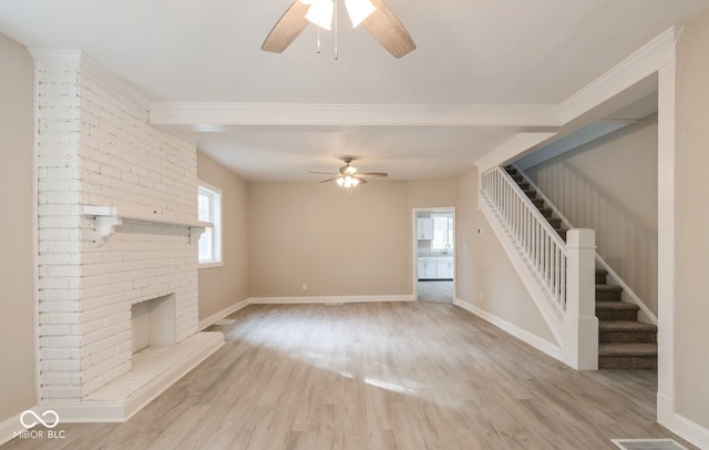 unfurnished living room featuring a brick fireplace, light wood-type flooring, and ceiling fan