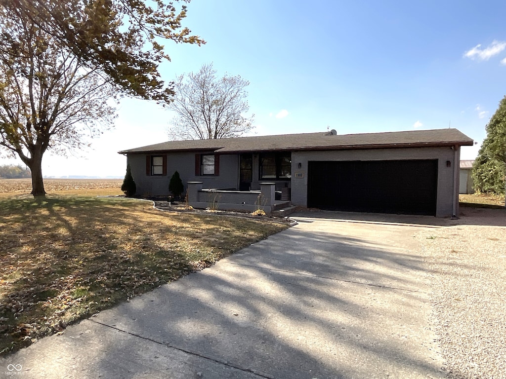 ranch-style house featuring a garage