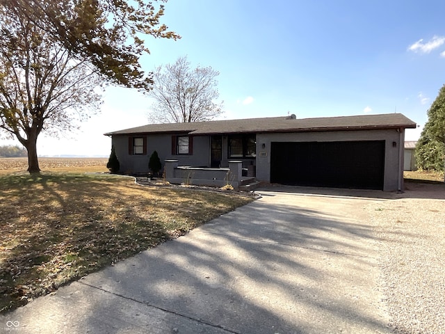 ranch-style house featuring a garage