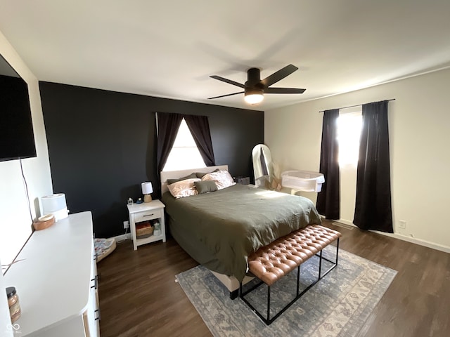 bedroom featuring dark wood-type flooring and ceiling fan