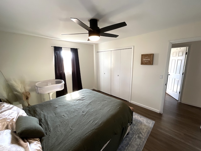 bedroom with a closet, ceiling fan, and dark wood-type flooring