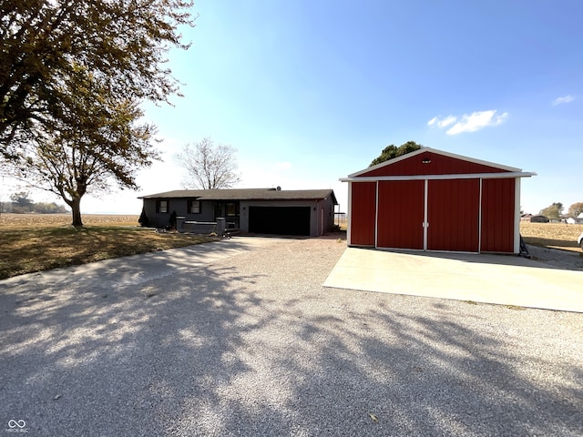 view of front of house featuring an outbuilding