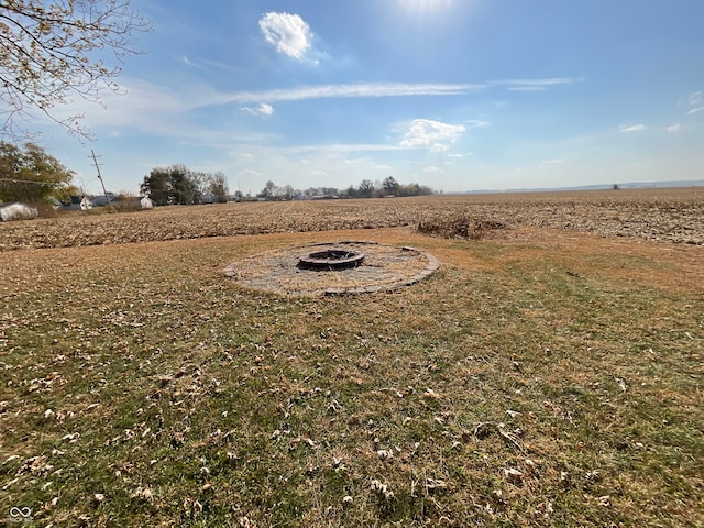 view of yard with a rural view