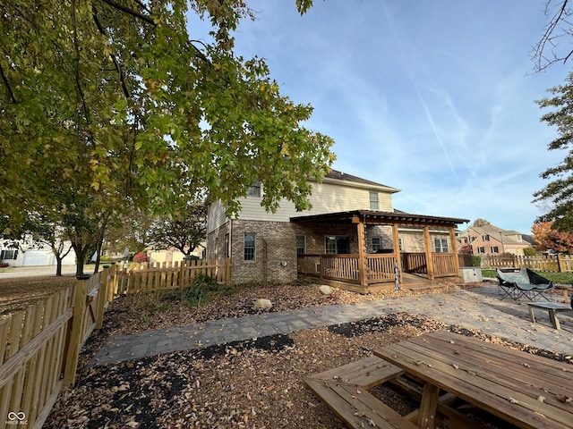 exterior space featuring a deck and a patio area