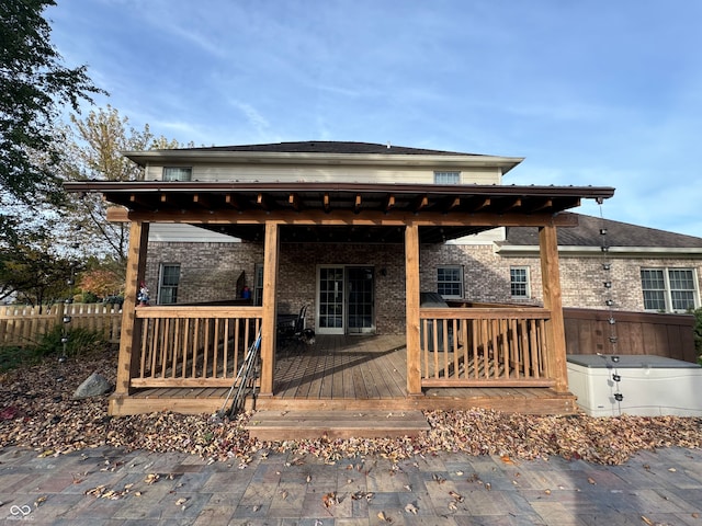 rear view of house featuring a deck