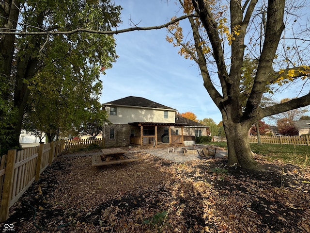 rear view of property featuring a patio