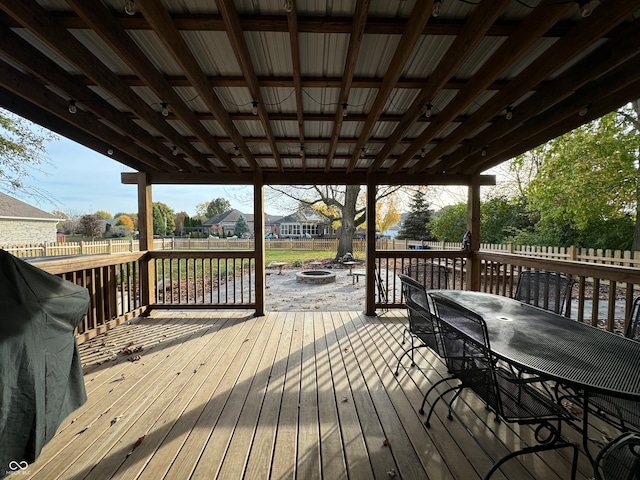 wooden terrace with an outdoor fire pit