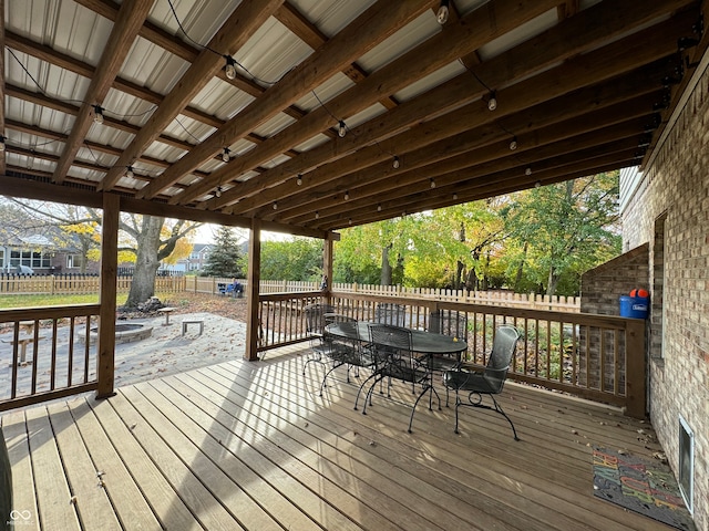 wooden terrace with an outdoor fire pit