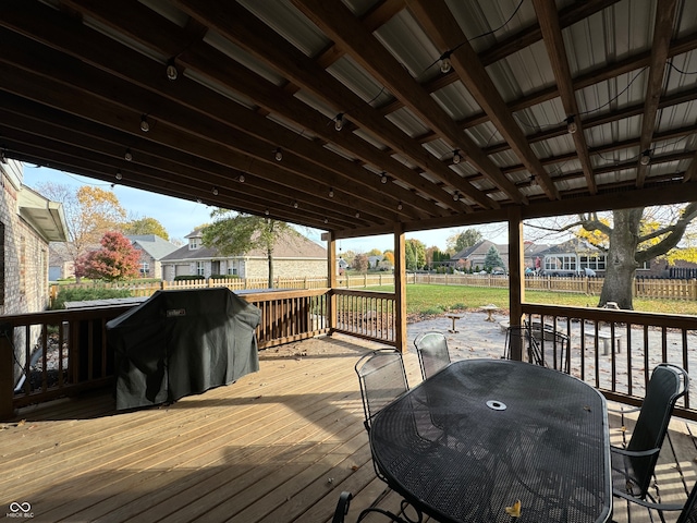 wooden terrace featuring grilling area