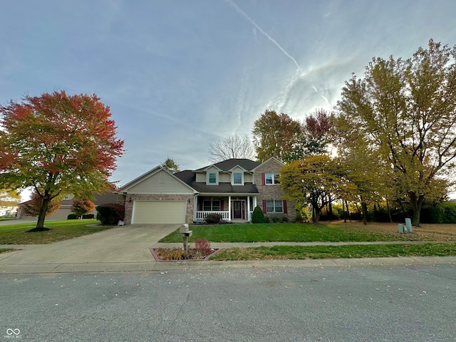 view of front of house with a garage and a front lawn