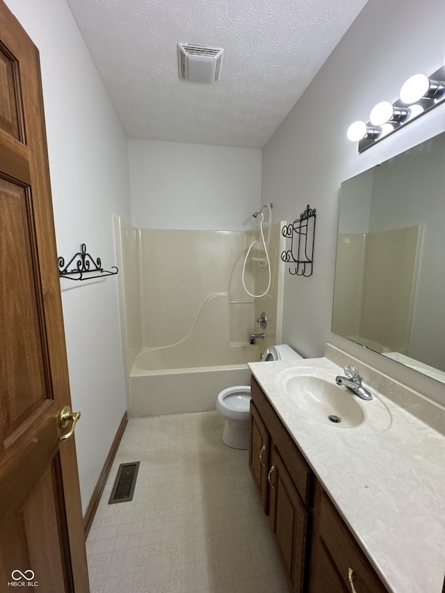 full bathroom featuring shower / tub combination, vanity, toilet, and a textured ceiling