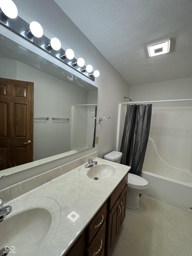 full bathroom featuring vanity, shower / bathtub combination with curtain, a textured ceiling, and toilet