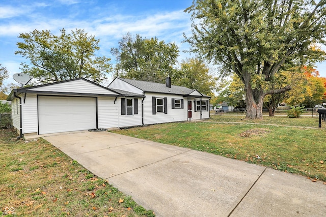 ranch-style home featuring a front yard and a garage