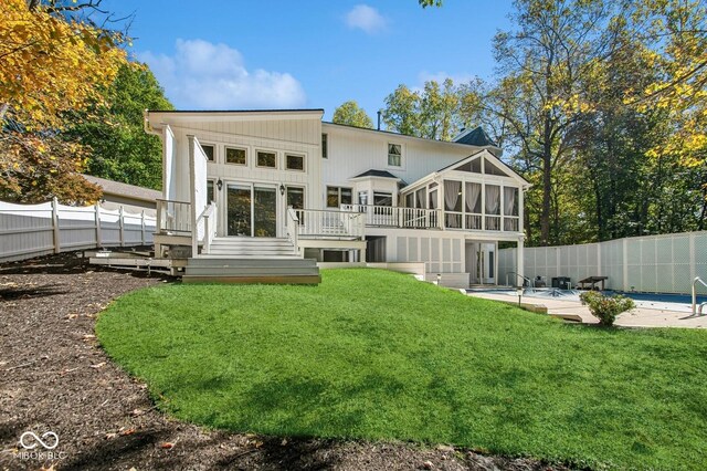 6902 Creekridge Trl, Indianapolis, IN 46256 - rear view of house featuring a sunroom, a wooden deck, a patio area, and stairway