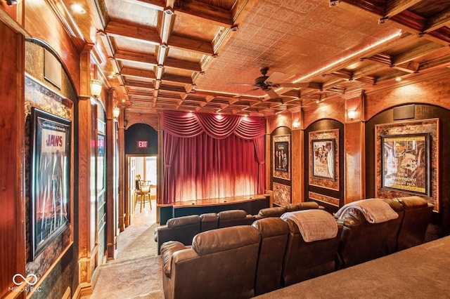 cinema featuring beamed ceiling, light colored carpet, ceiling fan, and coffered ceiling