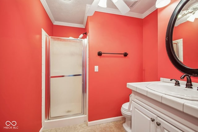 bathroom featuring ornamental molding, vanity, a textured ceiling, a shower with door, and toilet