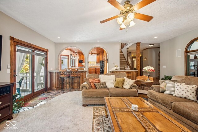 6902 Creekridge Trl, Indianapolis, IN 46256 - living room with a ceiling fan, recessed lighting, stairway, and arched walkways