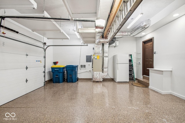 garage with electric panel and white fridge