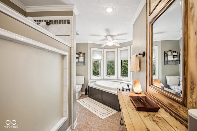 bathroom featuring a bathing tub, tile patterned floors, ceiling fan, toilet, and ornamental molding