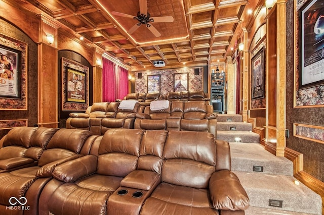 home theater featuring beam ceiling, crown molding, ceiling fan, and coffered ceiling