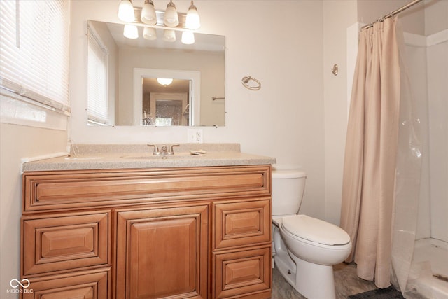 full bath with a shower stall, toilet, and vanity