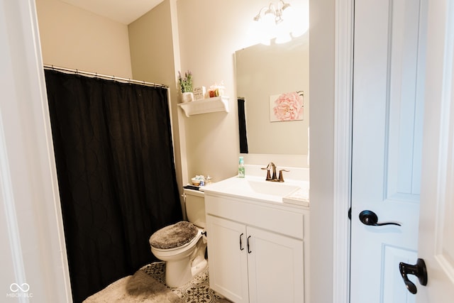 bathroom with toilet and vanity