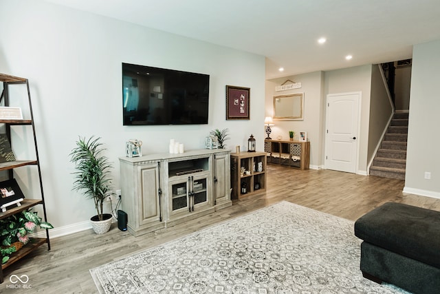 living room with light hardwood / wood-style floors