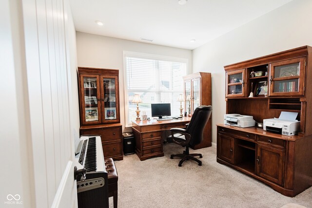 office area featuring light colored carpet