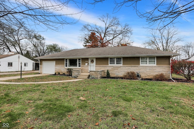 ranch-style home with a front lawn and a garage