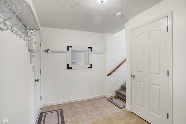 interior space featuring a textured ceiling