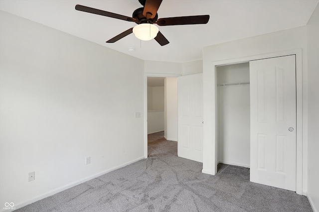 unfurnished bedroom featuring light carpet, a closet, and ceiling fan