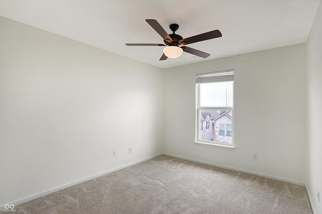 empty room featuring ceiling fan and carpet floors