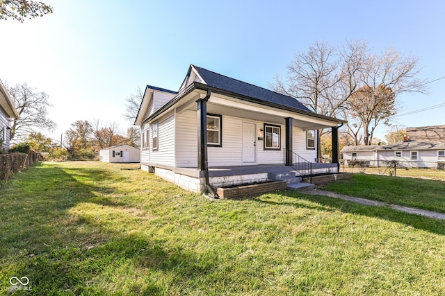 bungalow-style home featuring a front yard and a porch