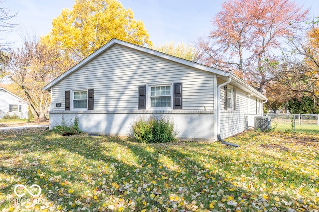 view of property exterior with a lawn