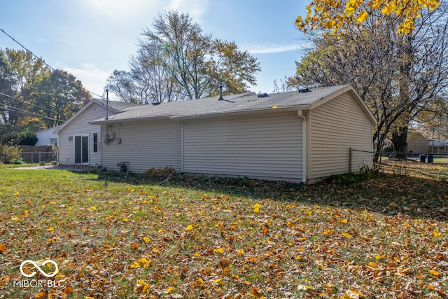 view of side of property with a yard