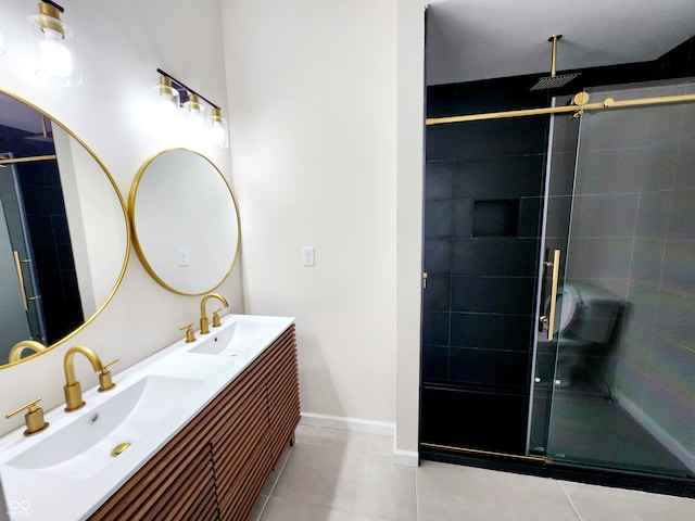 bathroom featuring vanity, tile patterned floors, and a shower with door