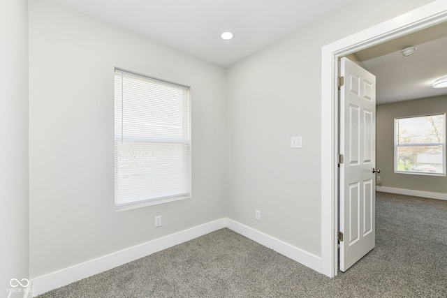 unfurnished room with carpet flooring